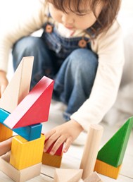 Child building blocks ABA therapy session