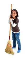 Girl holding broom getting ready to do chores for kids