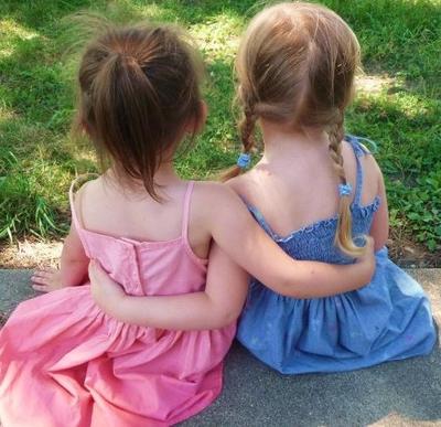 Little girls hugging photo contest winner