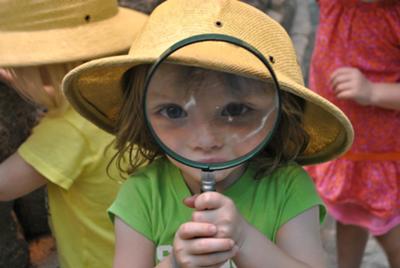 Girl with magnifying glass photo contest winne