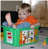 child in legos bucket receiving autism therapy