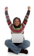 Girl with arms raised holding computer, excited about finding a free work from home opportunity online