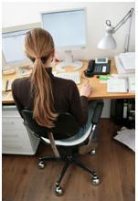 Lady on her computer engaging in google work from home while online