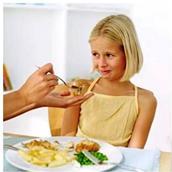 little girl refusing to eat certain food because she is a picky eater