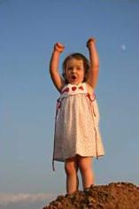 child raising arms that is sensory seeking