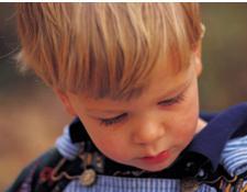 little boy staring into space showing signs of autism in toddlers