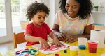 Boy doing tactile defensiveness treatment with paint